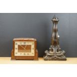 A wooden cased chiming mantle clock together with an Art Deco style figural table lamp.