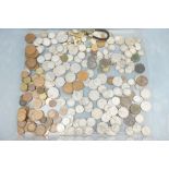 A collection of mainly British pre decimal coins to include silver examples.