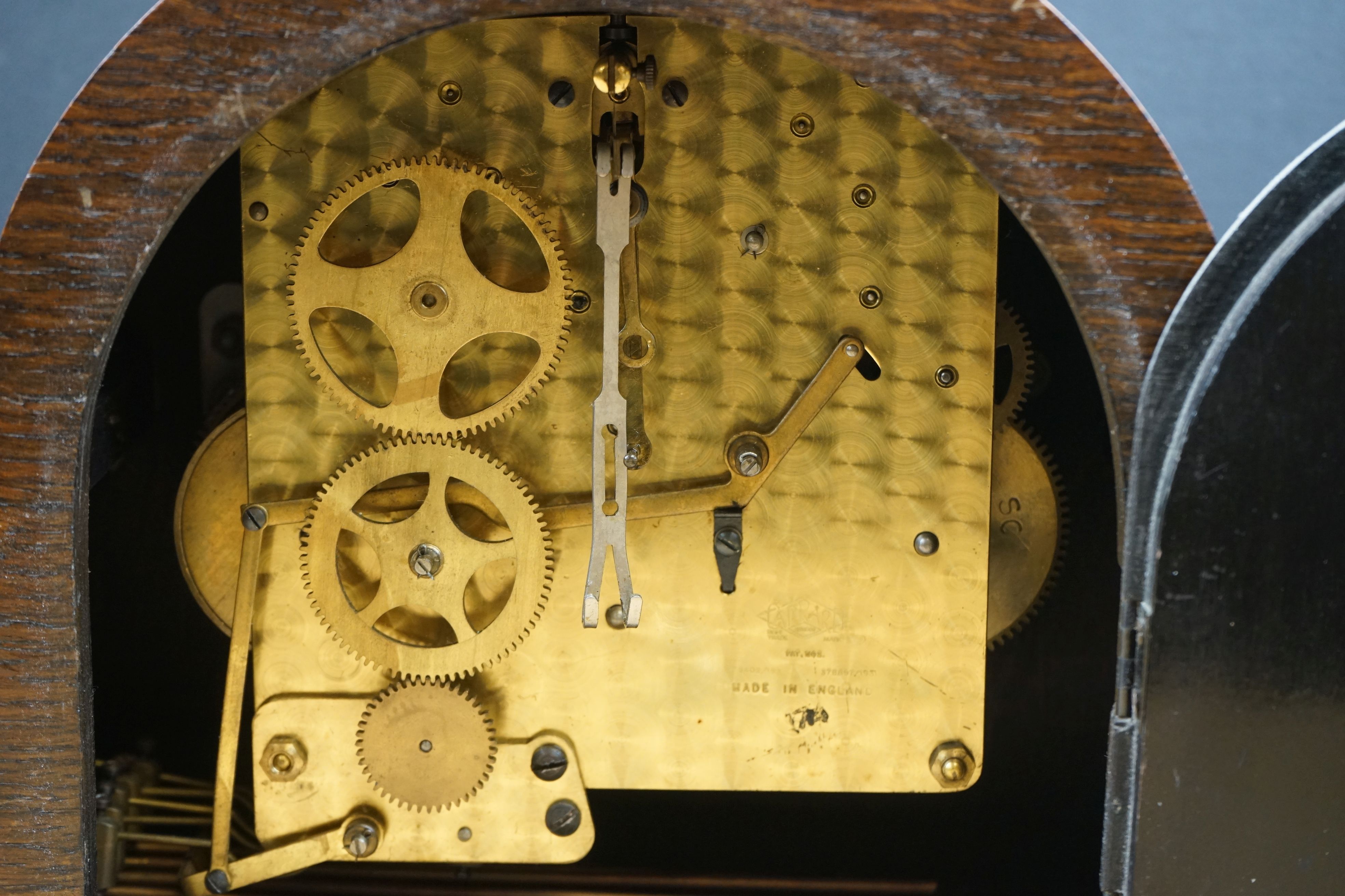 Two wooden cased mantle clocks to include a chiming example, both marked by Swindon retailers. - Image 7 of 8