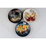 Three Moorcroft Pin Dishes in the Apollo, Butterfly and Reeds at Sunset patterns, 12cms diameter
