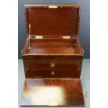 An antique mahogany canteen box with folding front, two inner drawers and brass fittings.