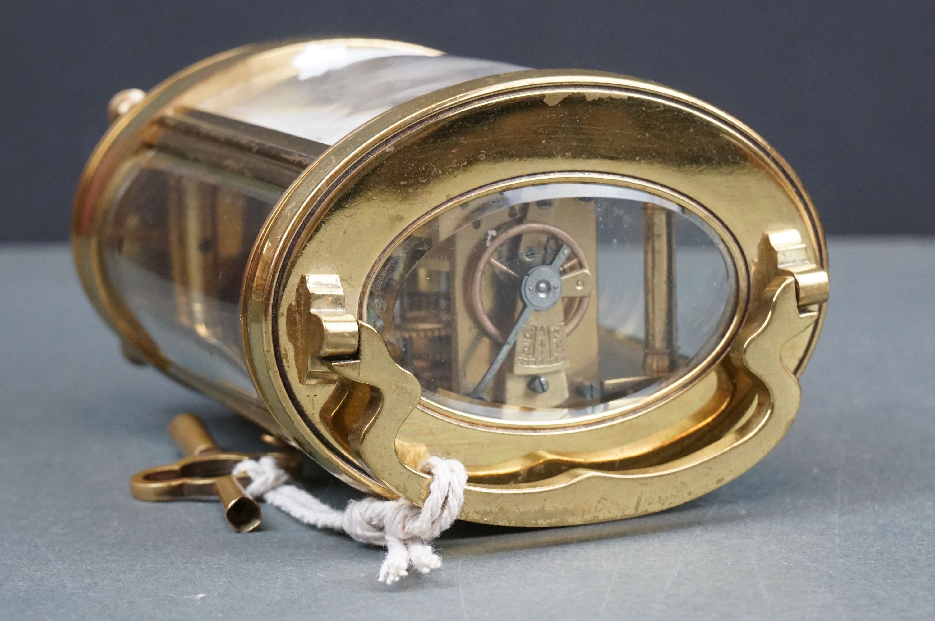 An antique brass cased carriage clock with white enamel dial, complete with key. - Image 9 of 9