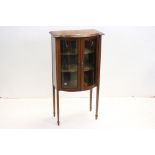 Edwardian Mahogany Inlaid Mahogany Bow Fronted Display Cabinet raised on square tapering legs and