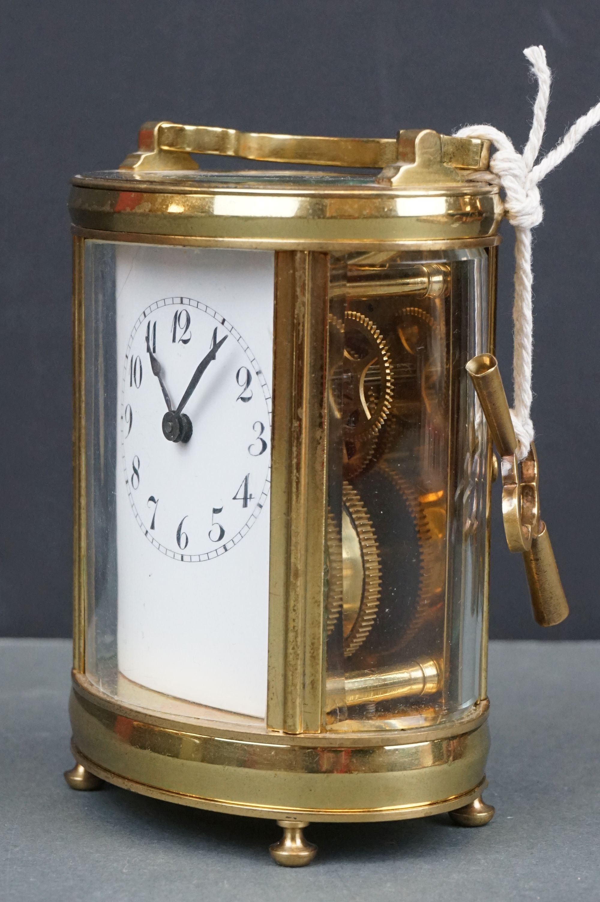 An antique brass cased carriage clock with white enamel dial, complete with key. - Image 3 of 9