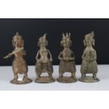 A collection of four south East Asian gilt metal musician figures.