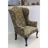 George III style Wingback Armchair raised on front cabriole legs and pad feet, 91cms wide x 123cms