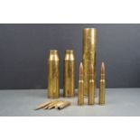 A small collection of inert military artillery shells and bullet cases.