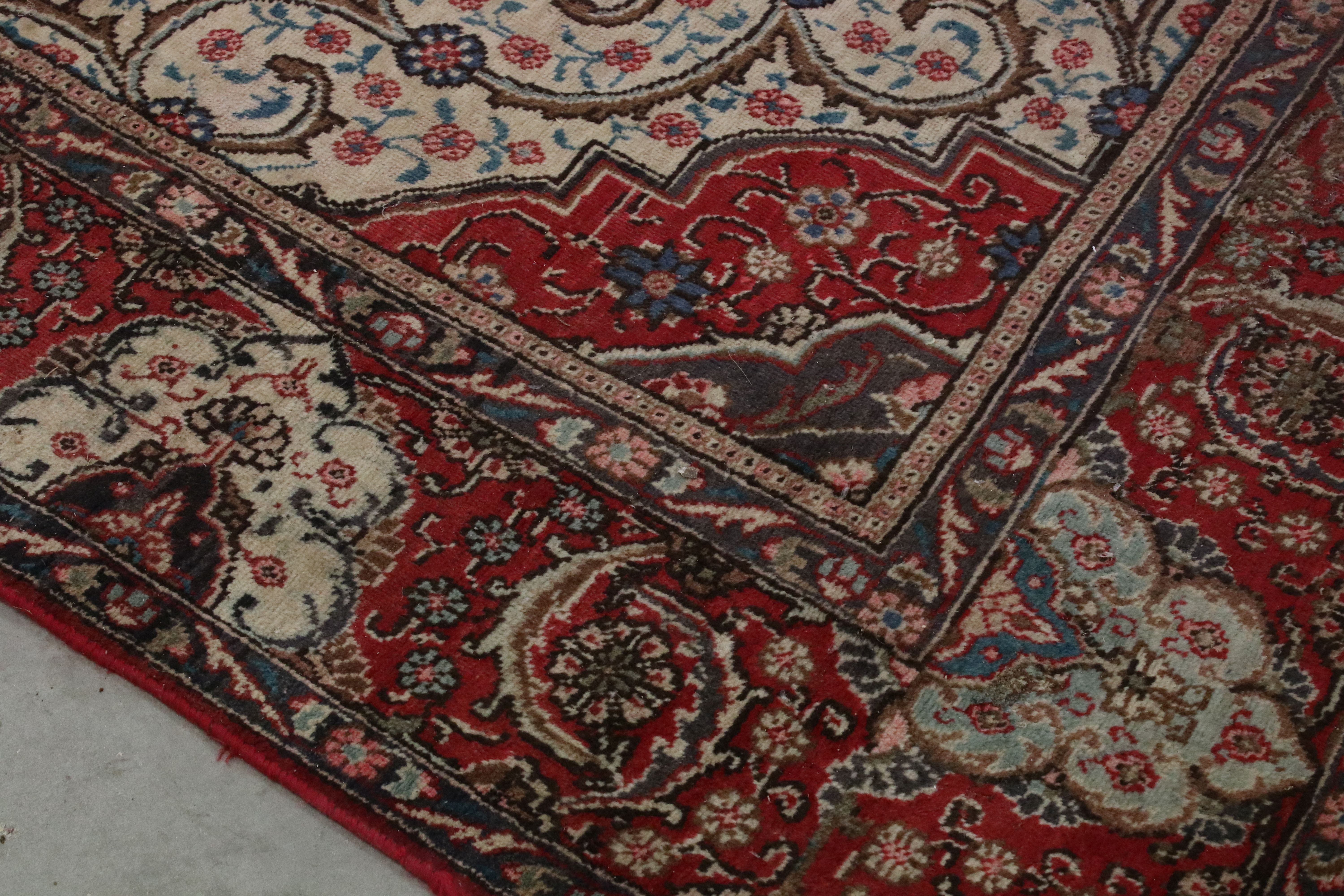 Large Wool Red Ground Rug with floral pattern within a border, 279cms x 396cms - Image 10 of 10