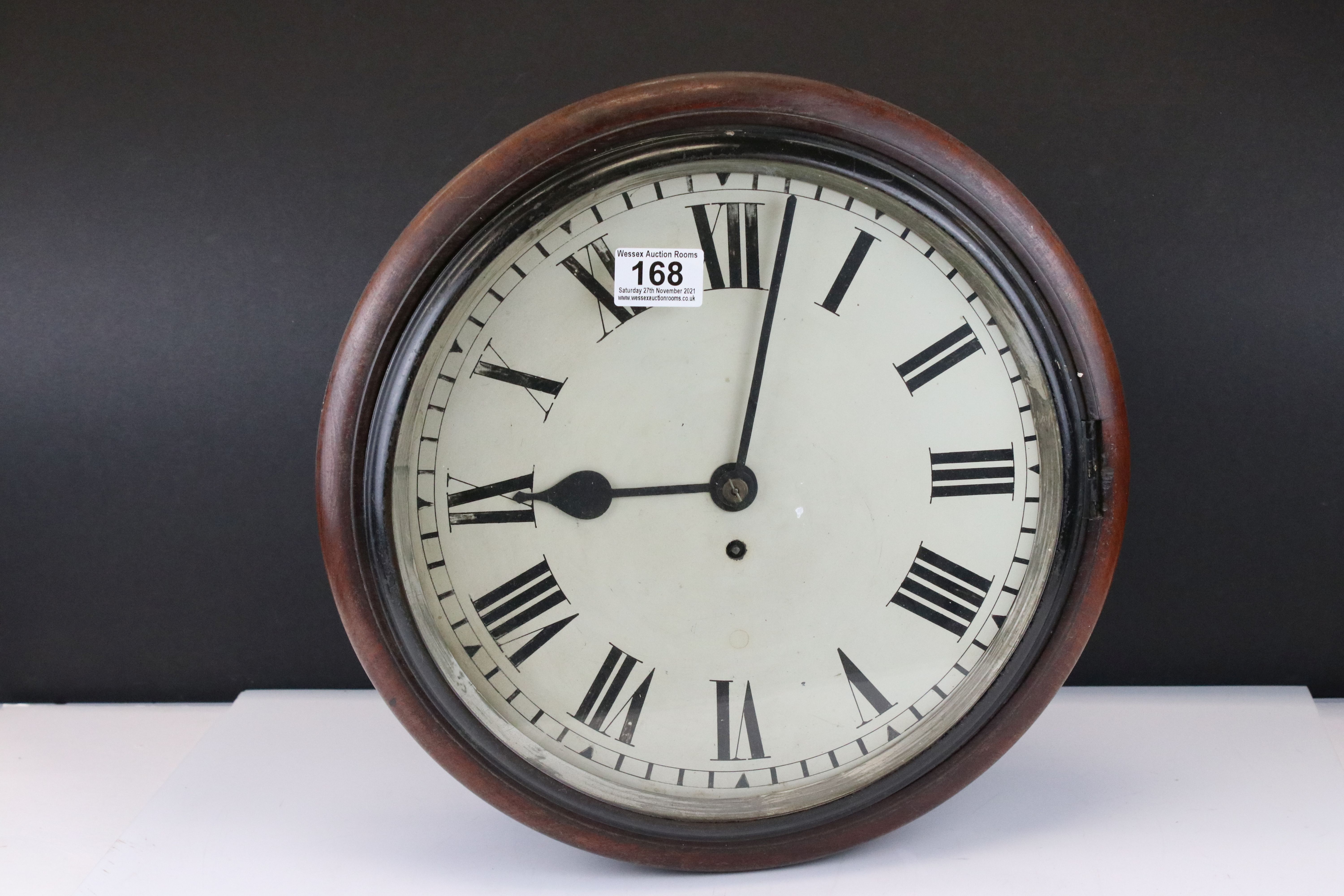 19th century Mahogany Circular Wall Hanging Clock, the white face with Roman numerals and single