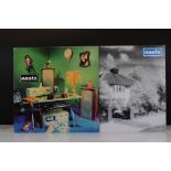 Vinyl - 2 Oasis 12" singles to include Live Forever (CRE 185T) and Shakermaker (CRE 182T). Sleeves