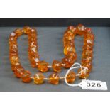 A vintage baltic amber strung beaded necklace.