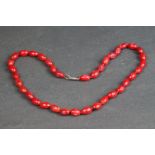 A vintage deep red coral beaded necklace.