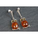 Pair of silver and amber style owl shaped earrings