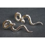 Pair of silver snake earrings