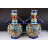 Pair of Burmantofts Faience Twin Handled Vases, the tube-lined decoration of a bird and snake with