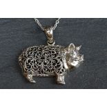 Silver pig pendant necklace on silver chain