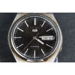 A vintage gents Seiko 5 with black dial and day / date function.