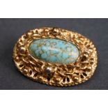 A vintage ladies yellow metal & turquoise brooch.