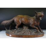 Black Forest Carved Wooden Standing Fox on a naturalistic ground with glass eyes, 52cms long x 28cms