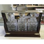 Superb mahogany antique style 3 item Tantalus with key and in working order, 3 x cut glass Whisky