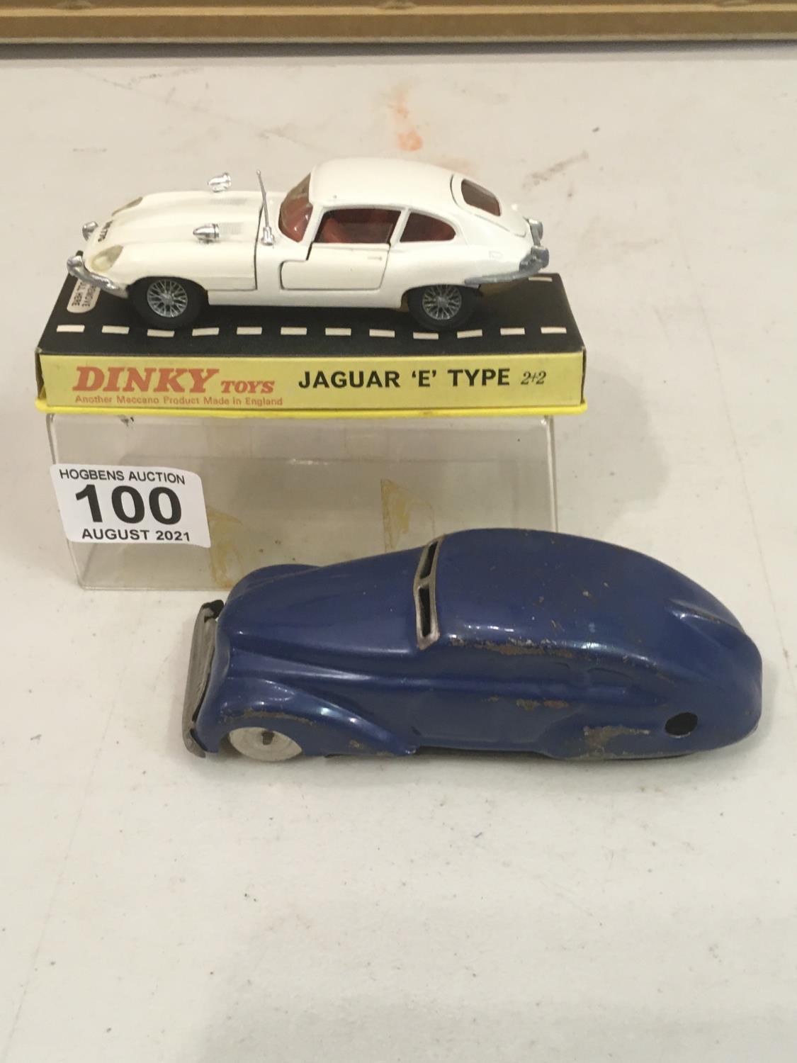 Dinky E-Type Jaguar, 2 + 2 white, with original packaging and a mechanical push along wind up tin