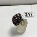Ladies gold coloured ring probably 9ct un-tested, set with a cluster of Amethyst stones, 6.3 grams,