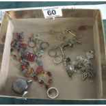 Amber beads, and other jewellery items including some tangled silver necklaces,