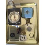 Collection of militray items inclduing compass, enamel badges, enamel compact 10