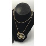 9ct gold chain with circular flower pendant, 7 grams,