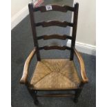 Children's 19 th century ladder backed chair with rush seating area