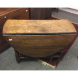 Georgian period oval topped oak double drop leaf dining table,