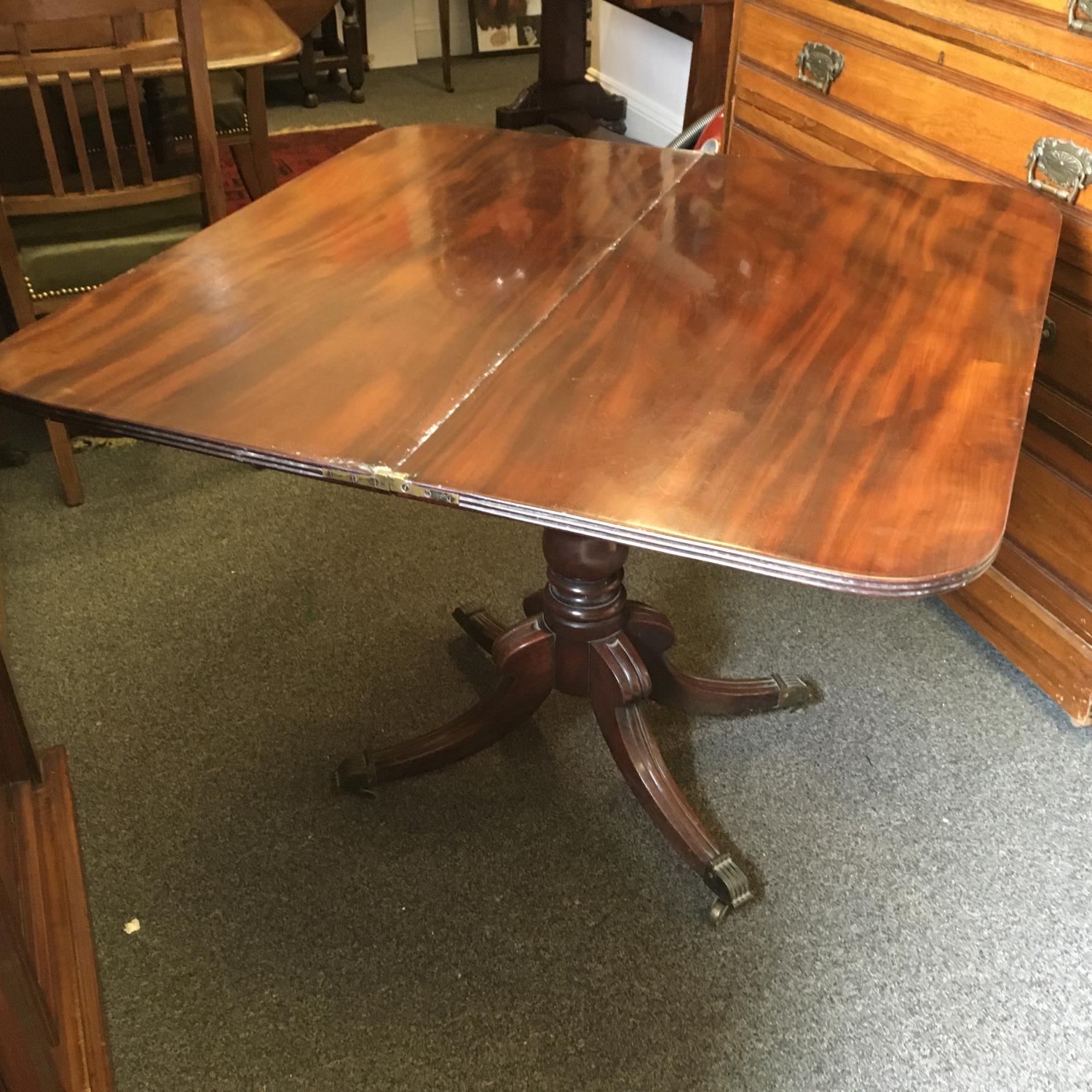 Regency period mahogany tea table with swivel action top revealing storage area below on 4 down - Image 2 of 3