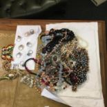 Amount of costume jewellery to include necklaces, 8 x cocktail rings, 6 assorted brooches,