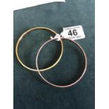 2 x bangles one marked 9ct metal core the other with metal core total weight 44 grams,