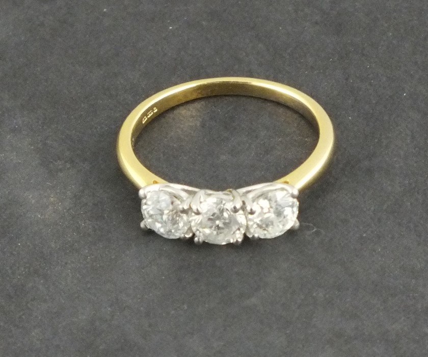 A three stone diamond ring, the brilliant cut stones totalling approx. 1.53ct, set in 18ct yellow - Image 2 of 2