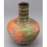 Sutton TAYLOR (British b. 1943) a narrow neck baluster shaped vase, in pink, green and lustre
