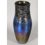 Norman Stewart CLARKE (British b. 1944) a baluster shaped vase, iridescent blue with palm trees,