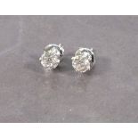 A pair of diamond ear studs, claw set in 18ct white gold, total weight 1.27ct