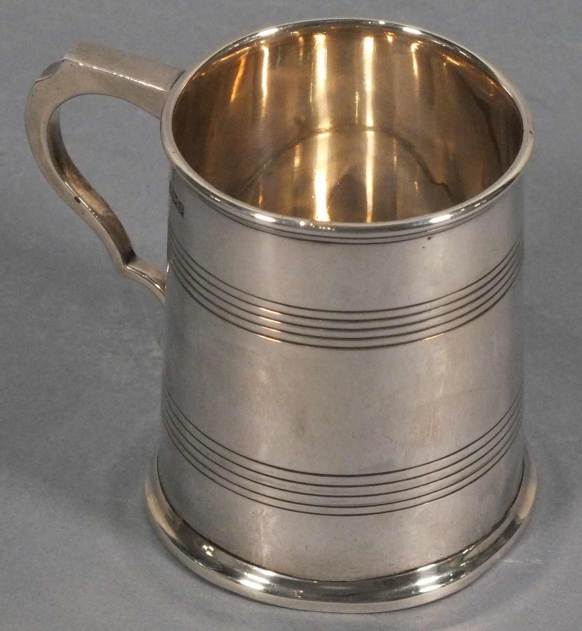 A silver christening mug, Sheffield 1907, Henry Atkin, of tapering cylindrical form, base