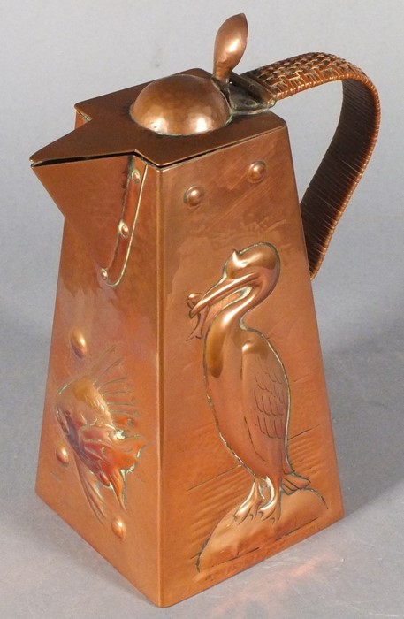 Newlyn hot water jug, of square tapering form with repousse decoration showing cormorants and