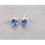 A pair of kyanite ear studs, the oval stones claw set in sliver