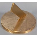 A brass sundial, calibrated for 51.5 degrees north, London, the engraved disc raised on a circular