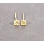A pair of diamond ear stud,  claw set in yellow gold, total weight approximately 0.61ct