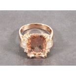 A morganite and diamond dress ring,  set in 18ct rose gold, the cushion shaped central stone 5.