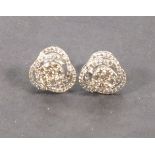 A pair of diamond cluster ear studs, set in 18ct white gold, the central cluster setting within