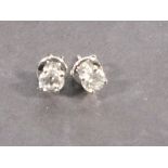 A pair of diamond ear studs, claw set in 18ct white gold, total weight 1.08ct
