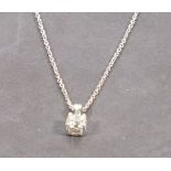 A diamond solitaire pendent, the claw set brilliant cut stone set within 18ct white gold on an 18 ct