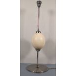 A contemporary desk lamp, of polished steel and incorporating an ostrich egg knop, 24.5" (62cm)