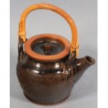 Scott MARSHALL (British 1936-2008) A small Boscean Pottery teapot with cane hoop handle, 4.25" (