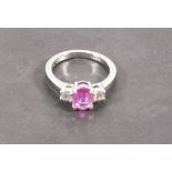 A pink sapphire and diamond dress ring, the arrangement of three stones in an 18ct white gold